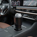 Portable heated and cooled drink holder placed in a car cup holder