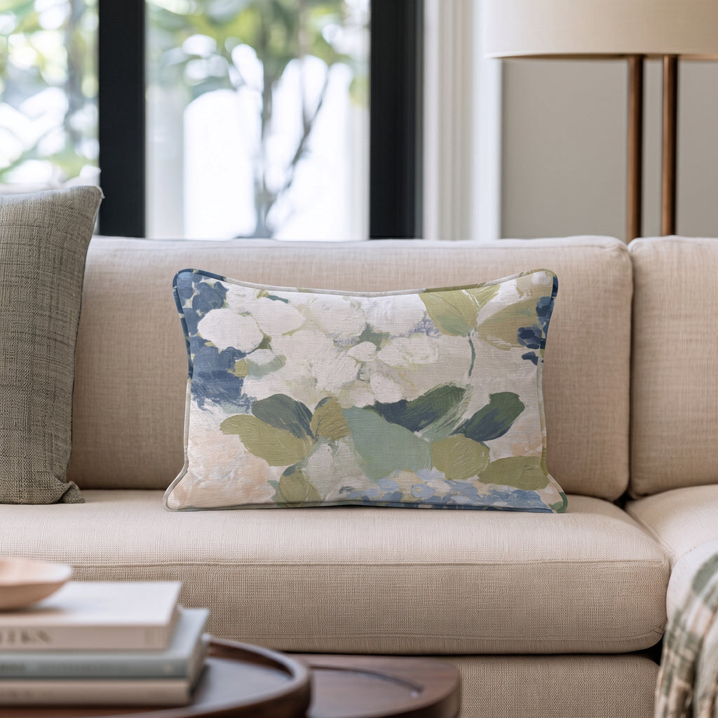 Blue floral throw pillow with botanical flowers and leaves