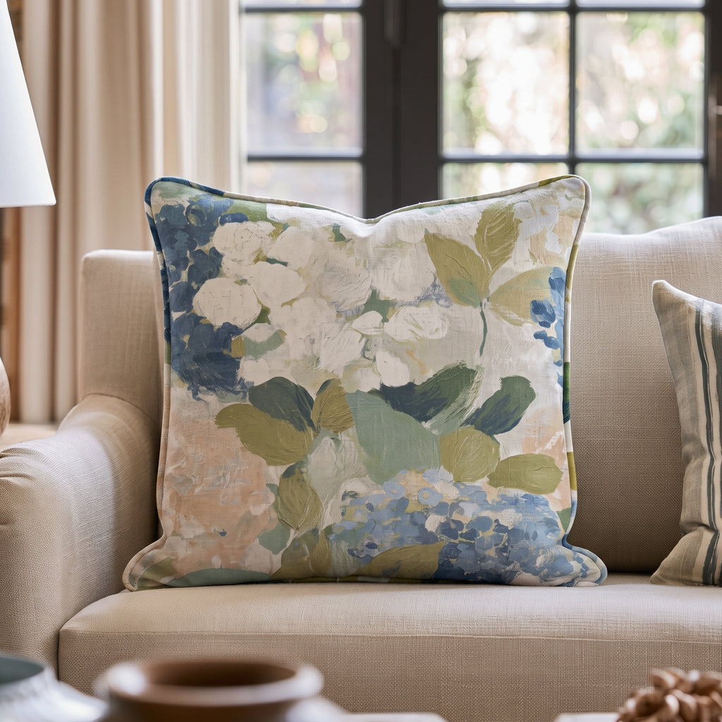 Blue floral throw pillow with botanical flowers and leaves