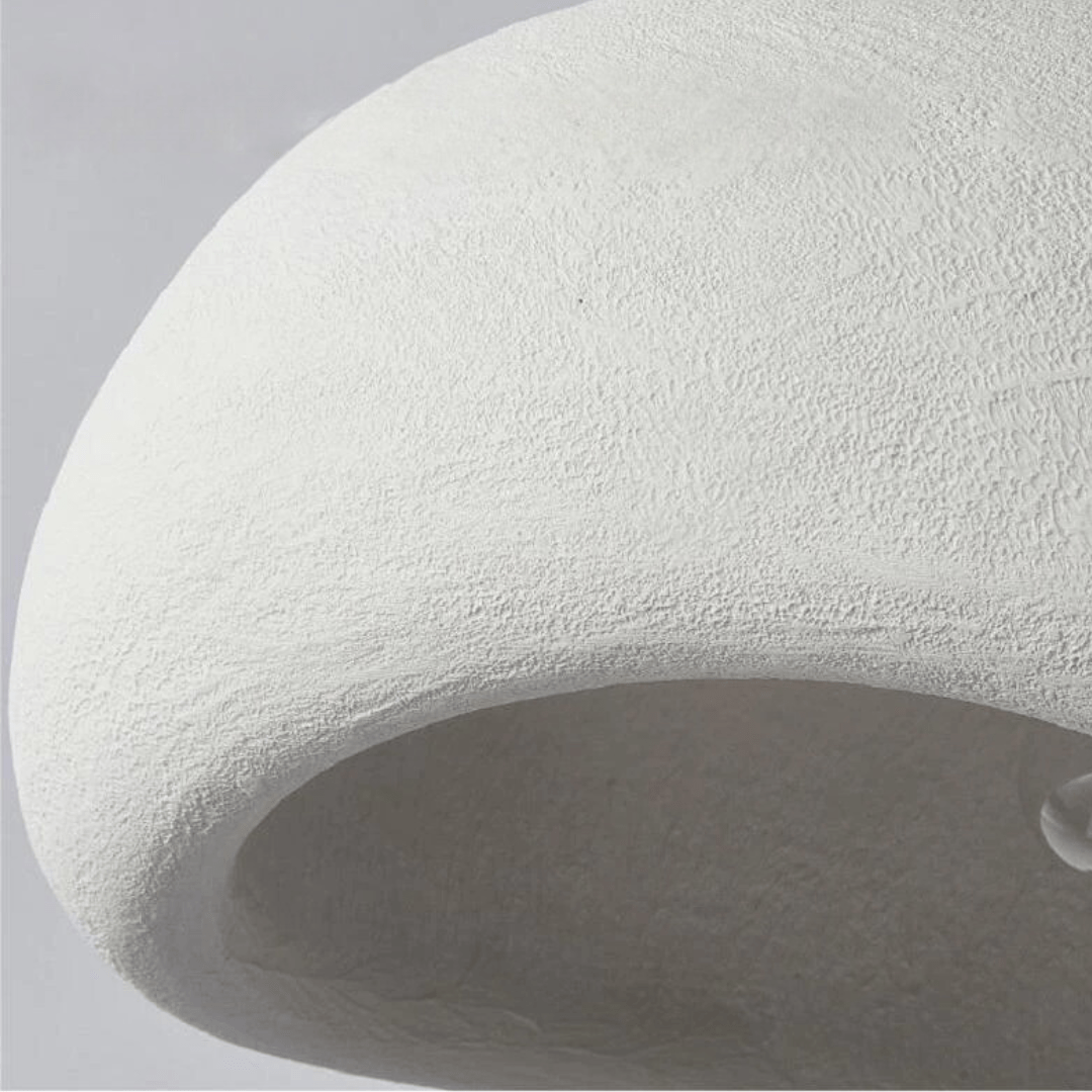 Curved dome pendant light with exposed bulb and warm glow