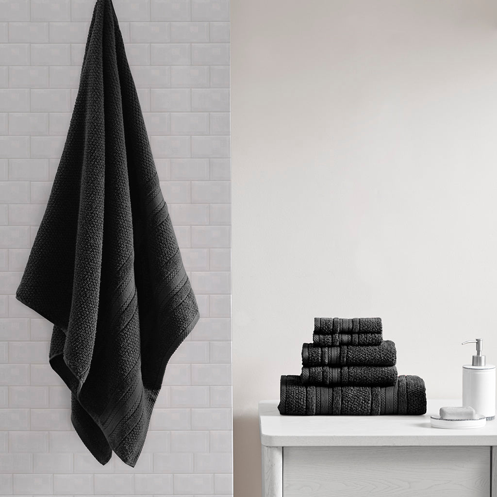 Six-piece textured bath towel set with decorative border detailing