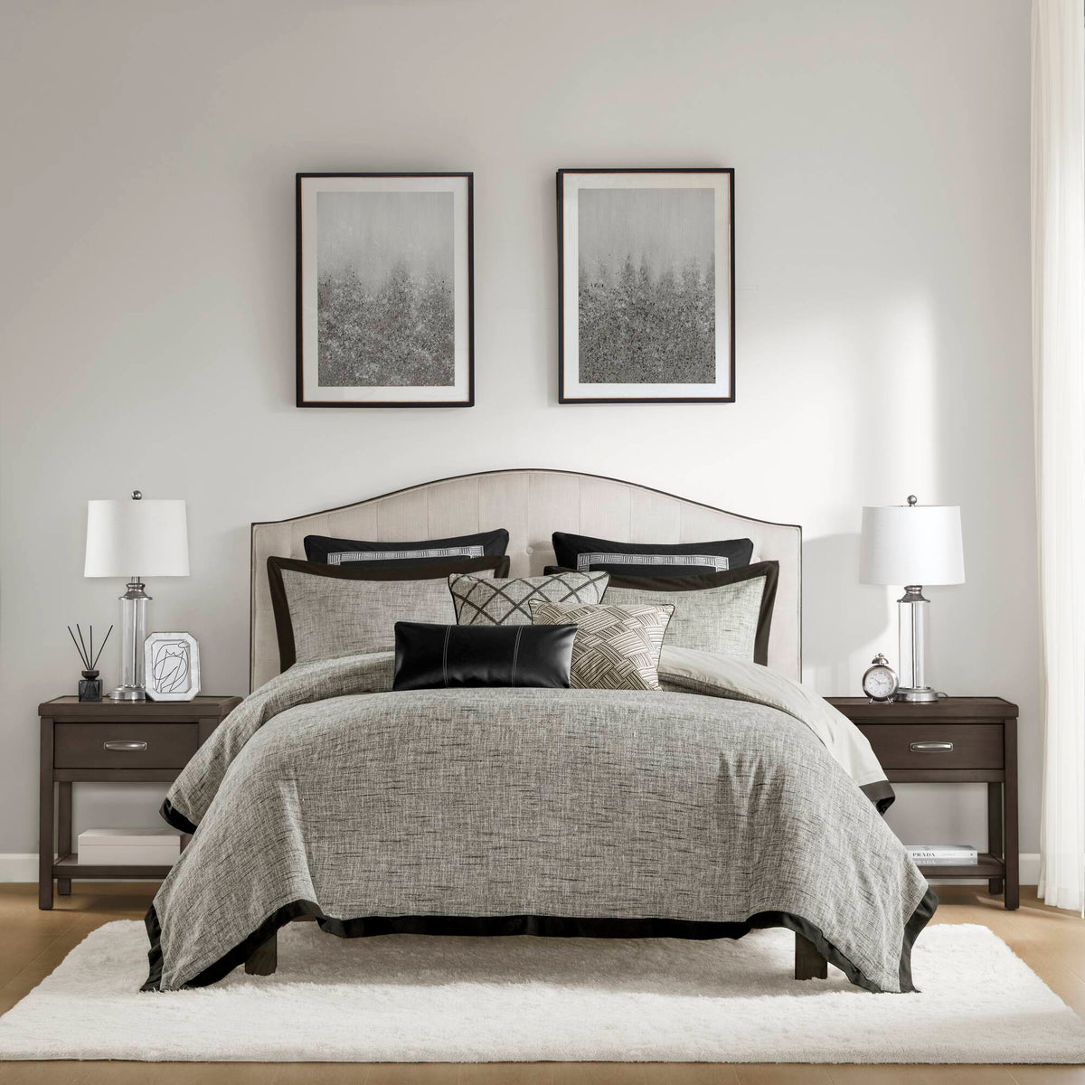 Grey textured jacquard comforter set arranged with geometric decorative pillows