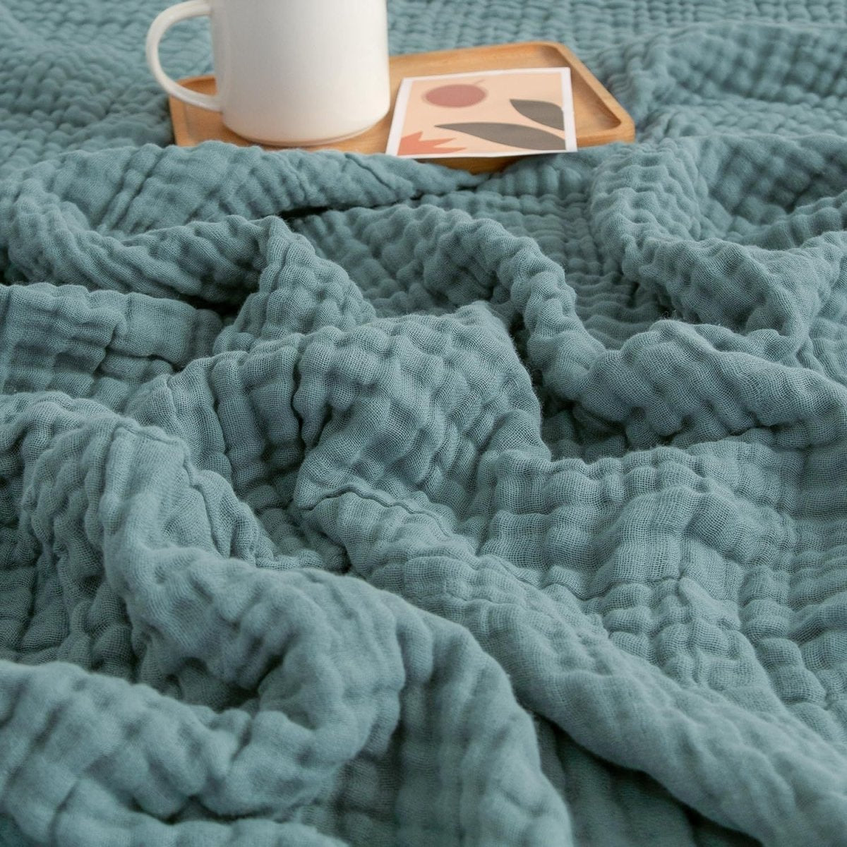 Textured wavy throw blanket draped over a chair