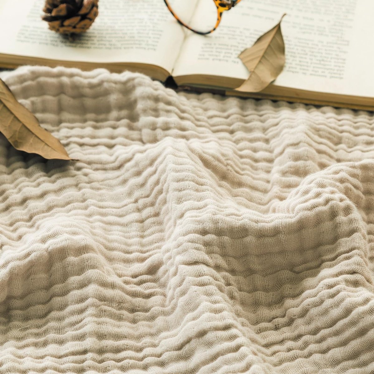 Textured wavy throw blanket draped over a chair