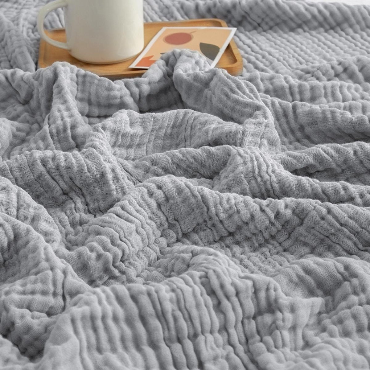 Textured wavy throw blanket draped over a chair