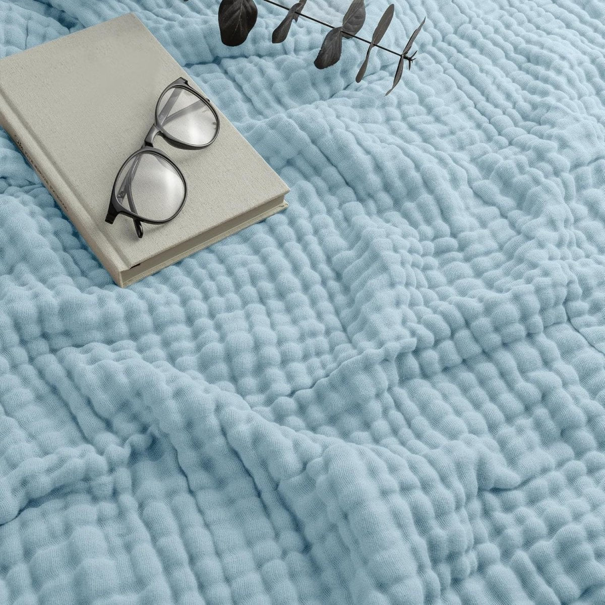 Textured wavy throw blanket draped over a chair