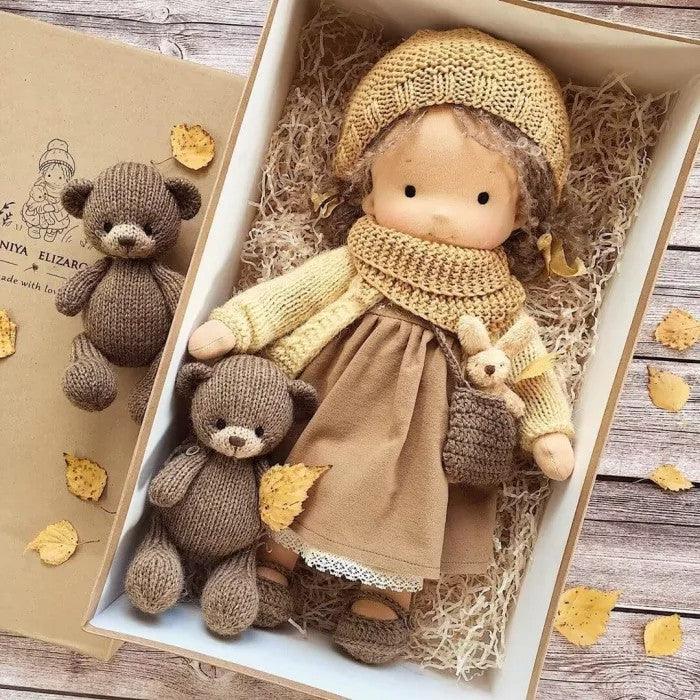 Handmade Waldorf doll in knitted clothing with soft features and character accessories