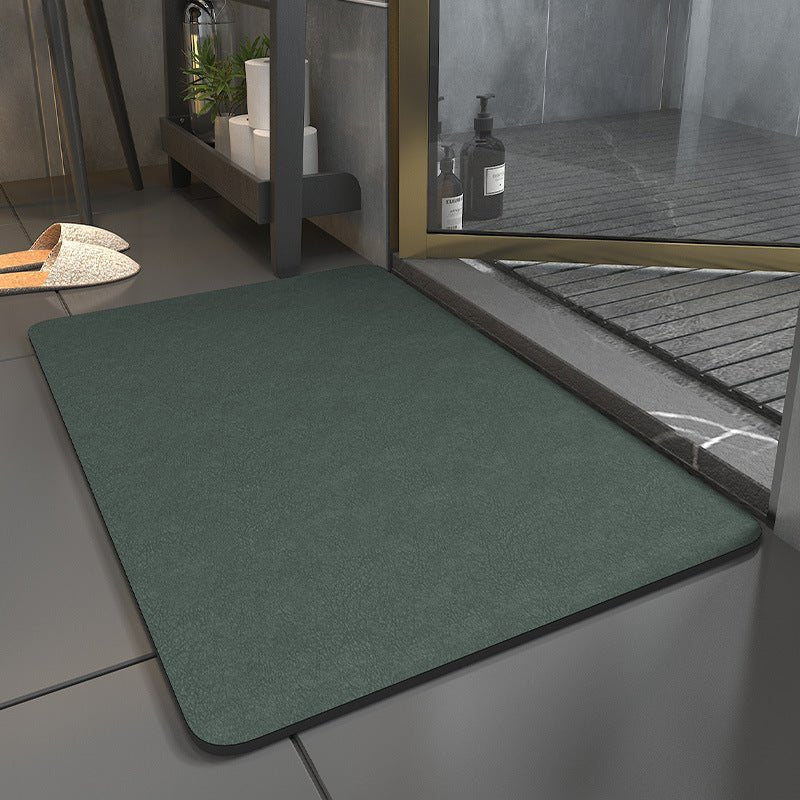 Rectangular bathroom mat with rounded corners and dark edging