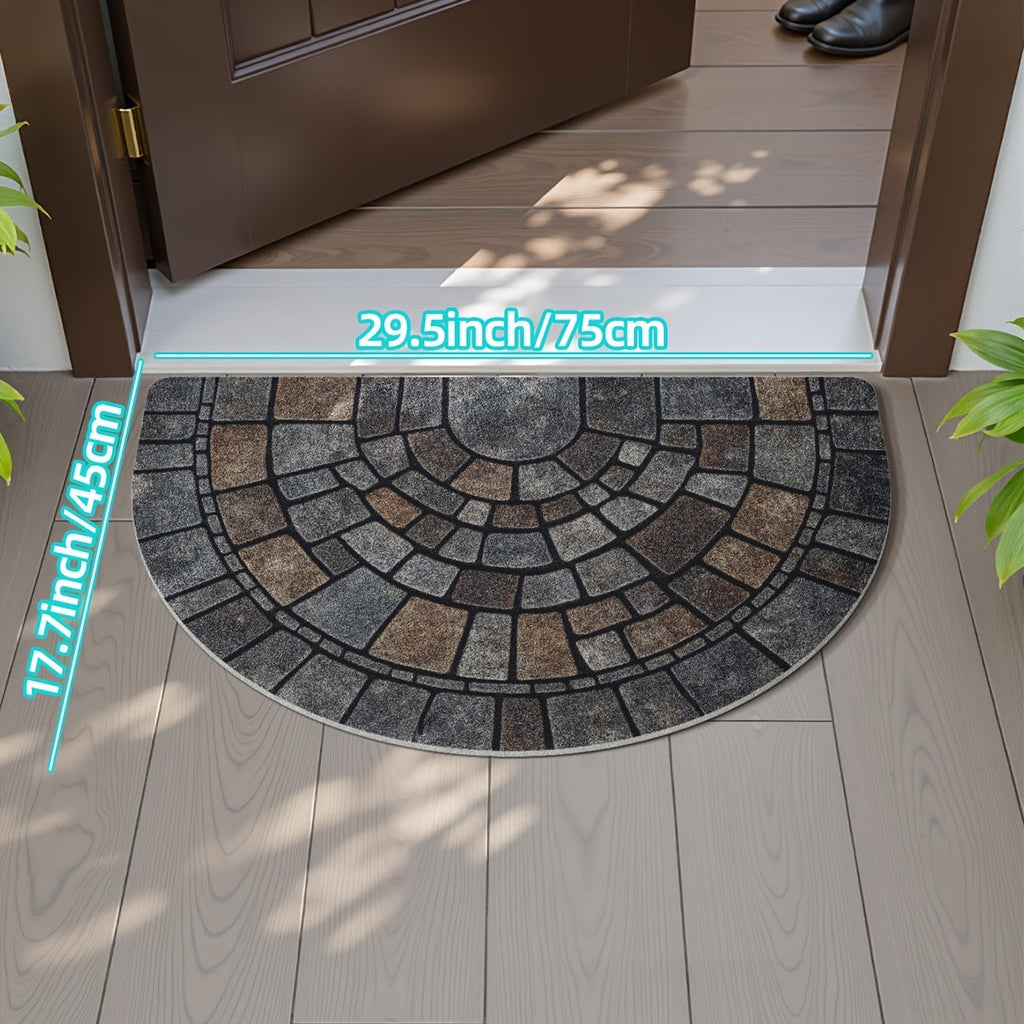 Grey half-circle door mat with geometric mosaic pattern