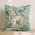 Blue floral throw pillow with a standing dog design and piped trim