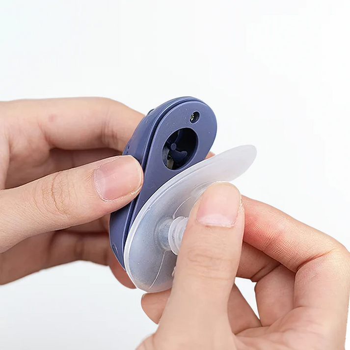 Compact CPAP machine with white nasal interface and side USB port
