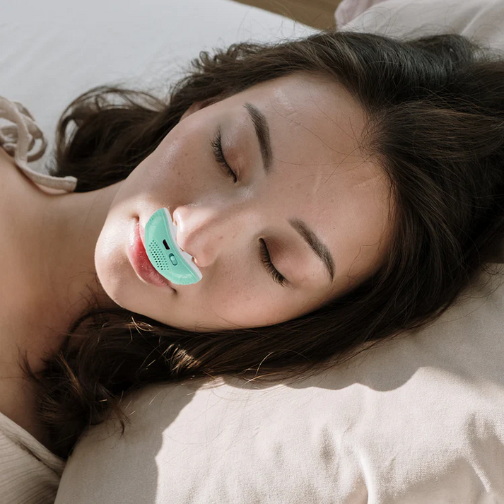Compact CPAP machine with white nasal interface and side USB port
