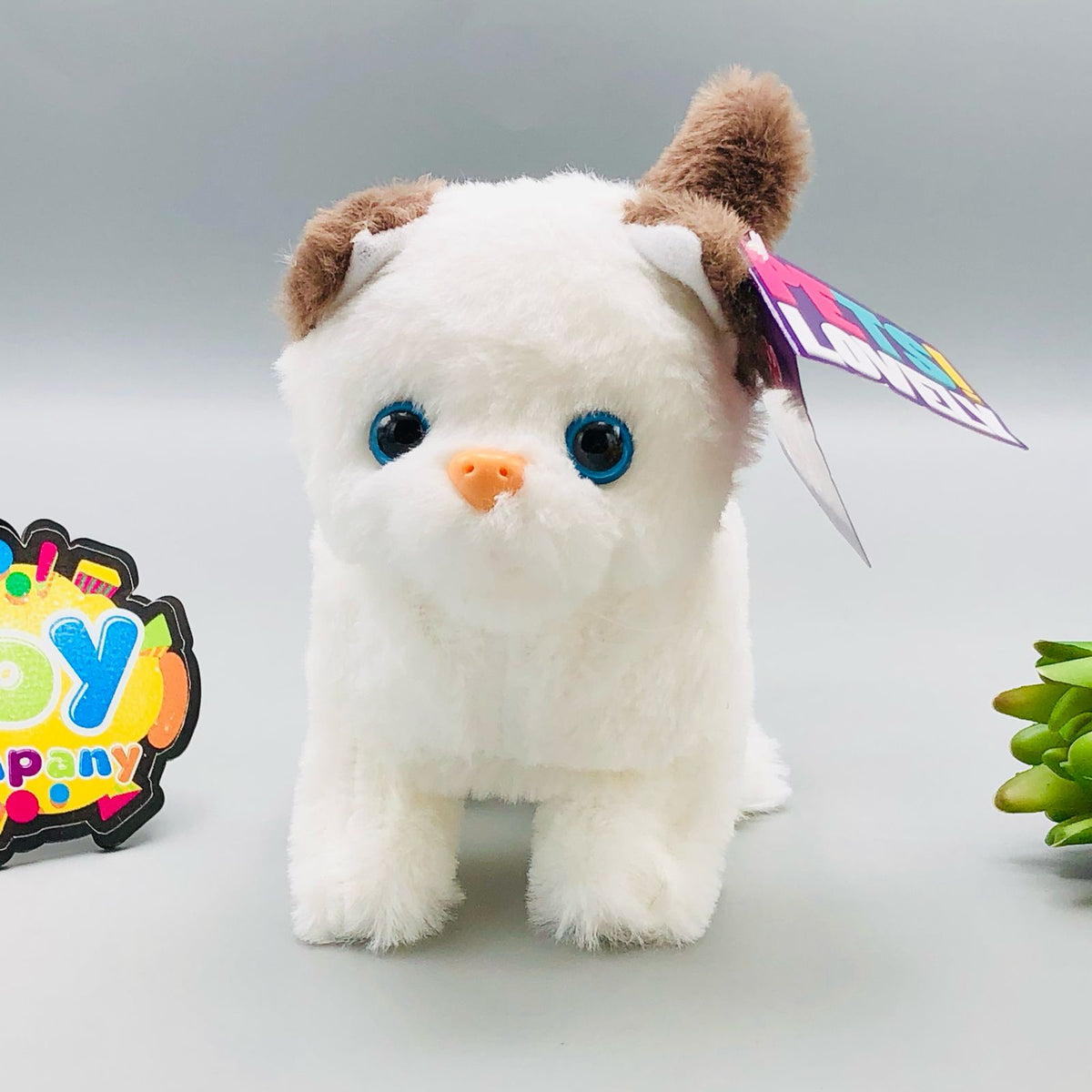 Walking plush cat toy with sound in white and orange colourways