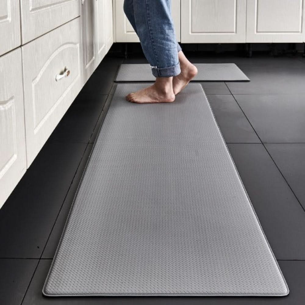 Textured rectangular anti-fatigue kitchen mat on a tiled floor