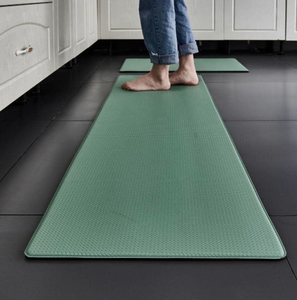 Textured rectangular anti-fatigue kitchen mat on a tiled floor
