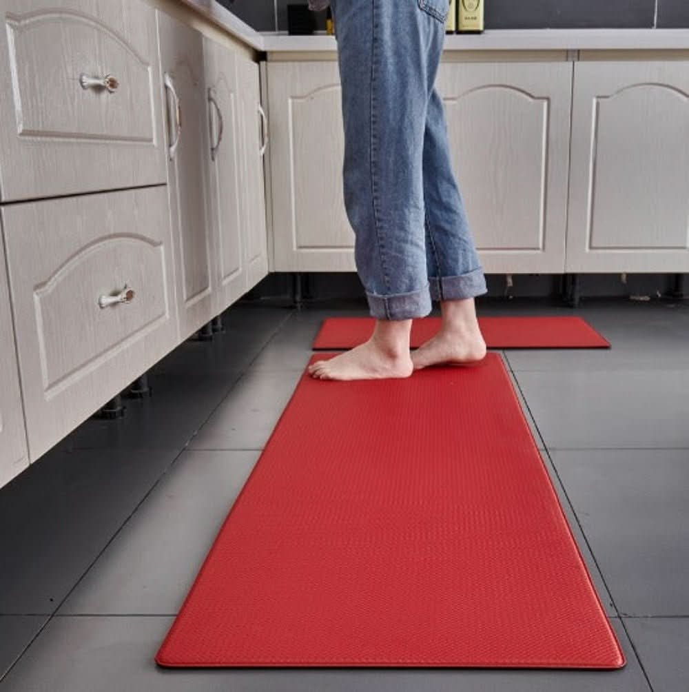 Textured rectangular anti-fatigue kitchen mat on a tiled floor