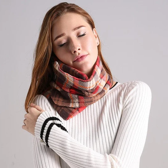 Compact travel neck pillow worn around the neck