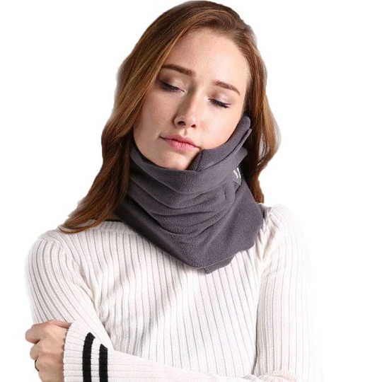 Compact travel neck pillow worn around the neck