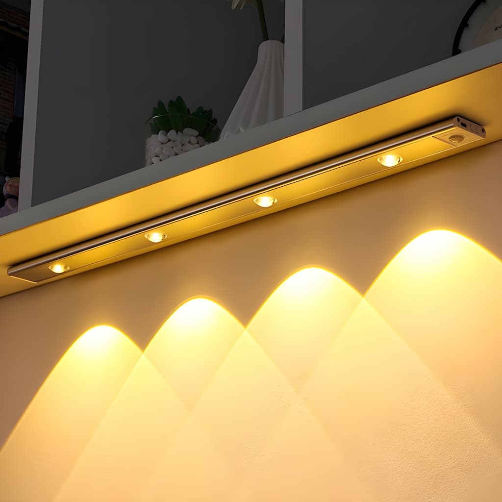 Wireless slim LED under cabinet light illuminating a kitchen worktop