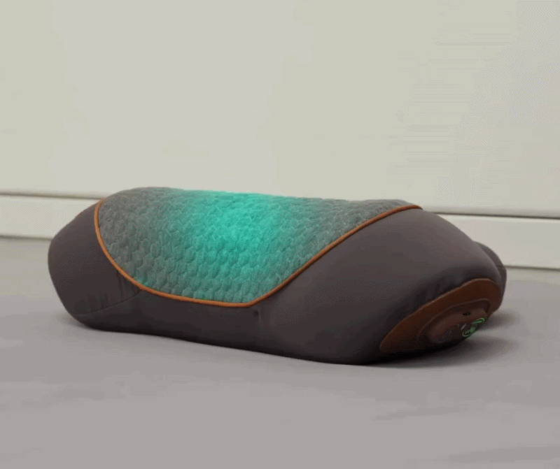 Grey 3-in-1 neck massage pillow with orange trim and padded side supports