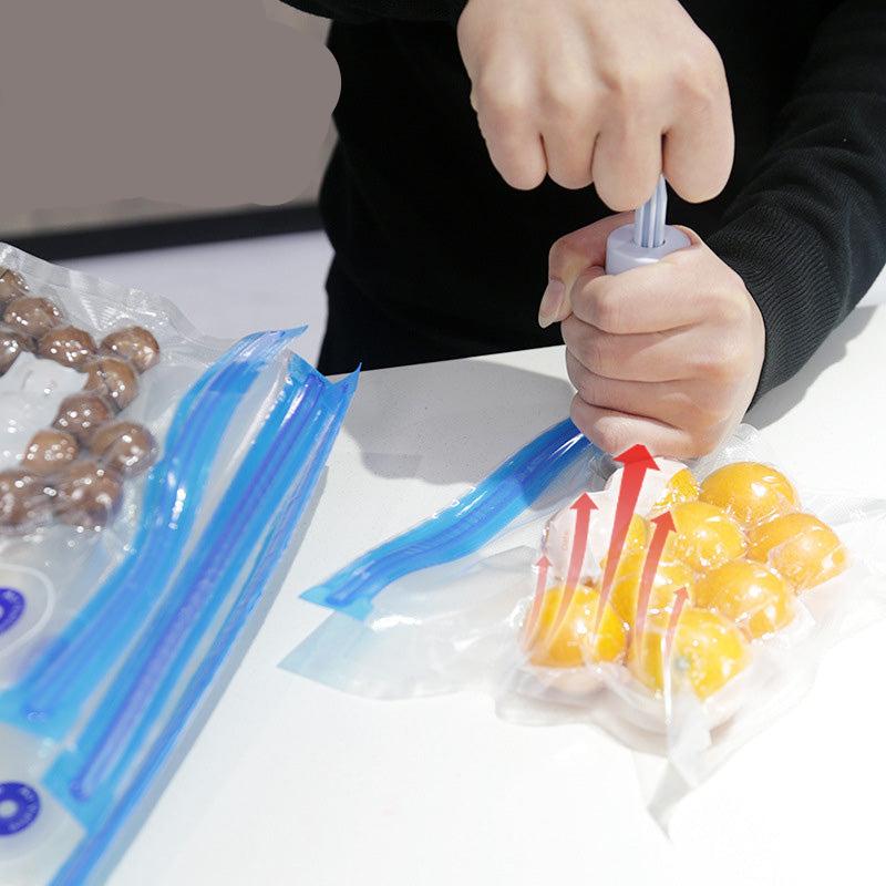 Clear reusable vacuum sealer bags with blue zip seals and hand pump
