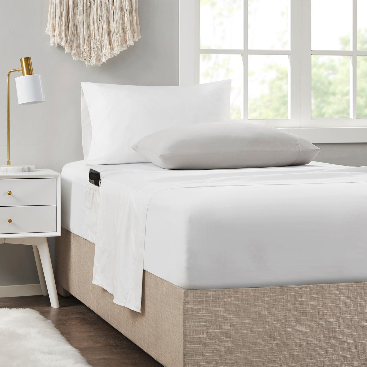 Floral comforter set with coordinating sheets and pillowcases on a bed