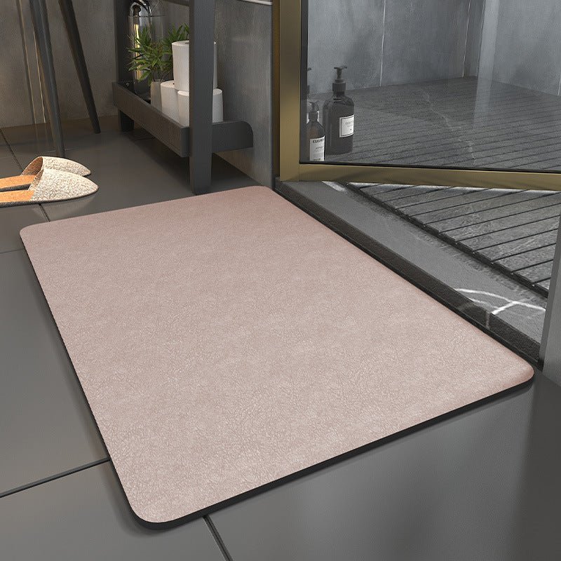 Rectangular bathroom mat with rounded corners and dark edging