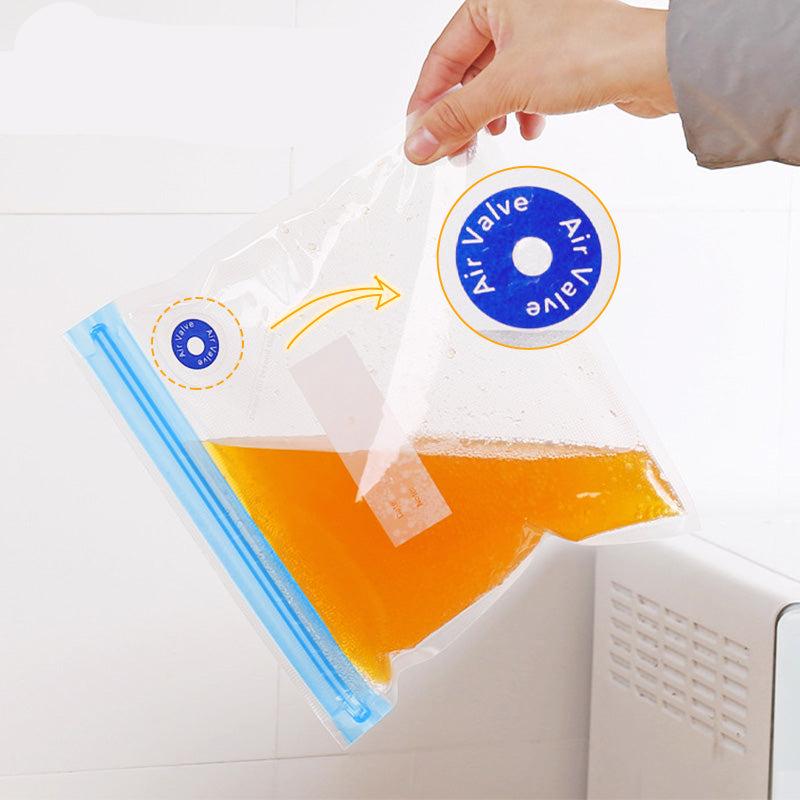 Clear reusable vacuum sealer bags with blue zip seals and hand pump