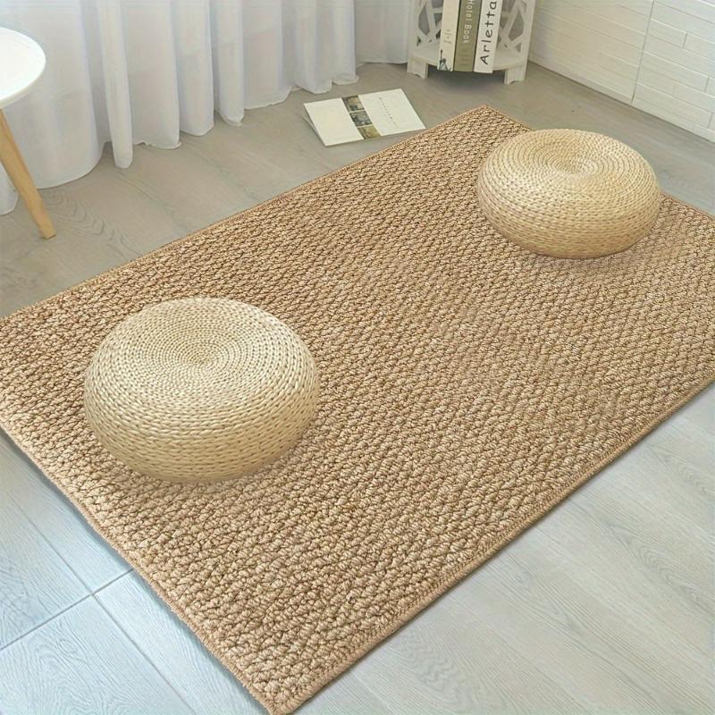 Textured beige rectangular non-slip door mat in an indoor entrance