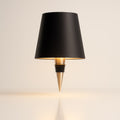 Table lamp with a tapered shade and pointed base