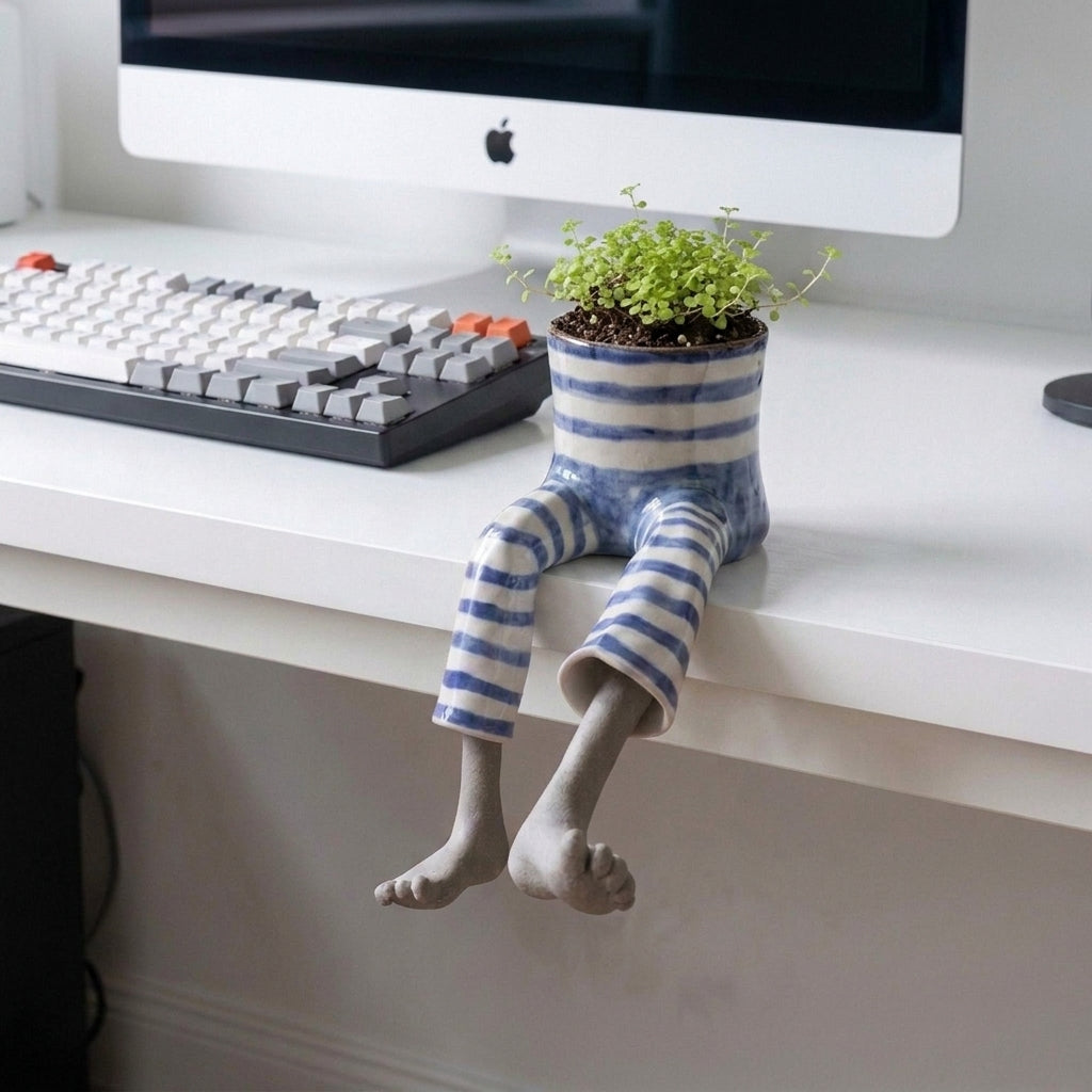 Boot-shaped decorative garden planter with integrated legs