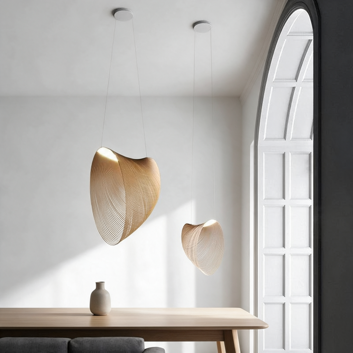 Sculptural pendant light with a curved open wire shade
