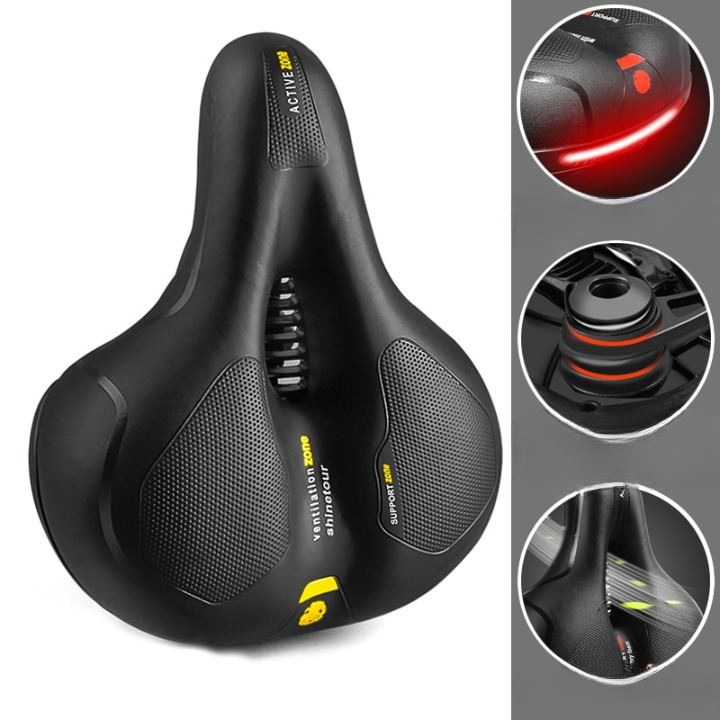 Ergonomic bicycle saddle with ventilated centre and textured comfort panels