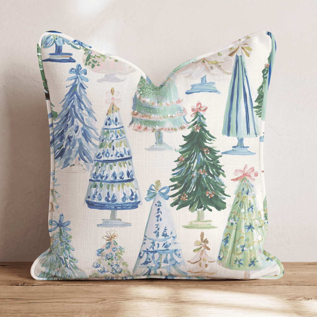 Cream Christmas throw cushion with illustrated decorated tree pattern and piped edging