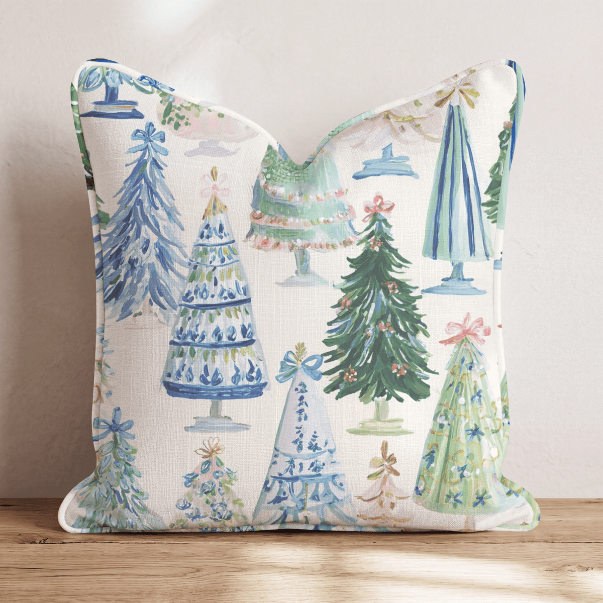 Cream Christmas throw cushion with illustrated decorated tree pattern and piped edging