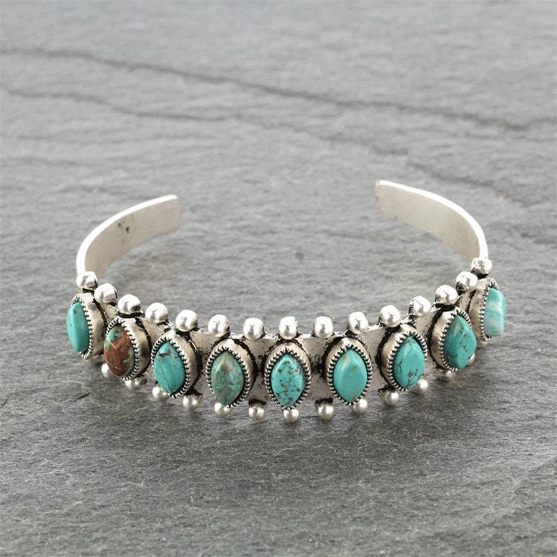 Silver-toned open cuff bracelet with turquoise-effect stones and bead details
