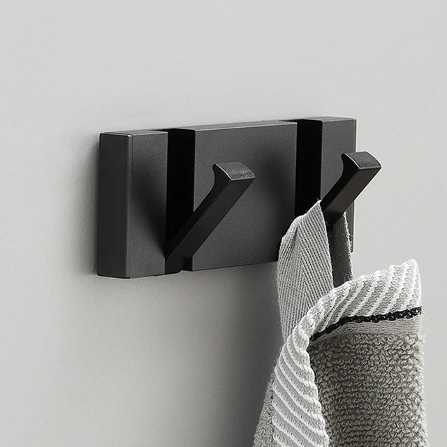 Wall-mounted rack with two folding hooks