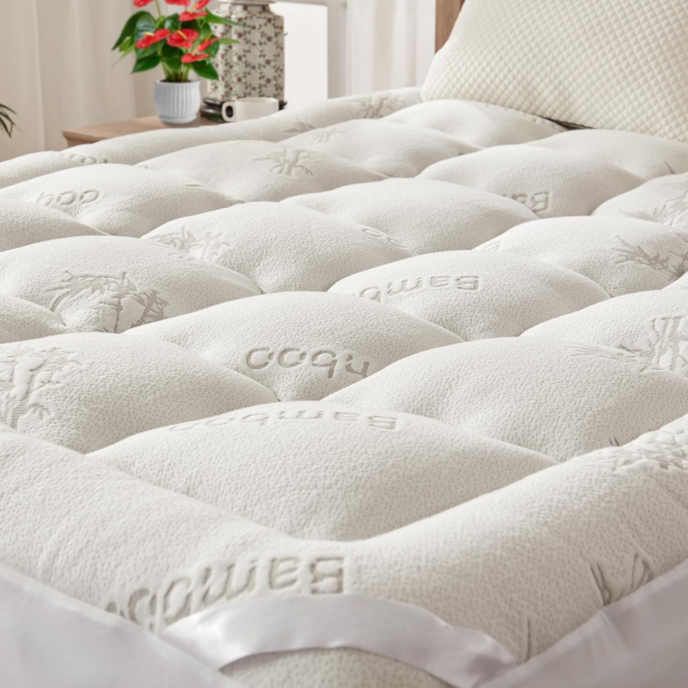 Quilted waterproof mattress cover with elasticated fitted edge