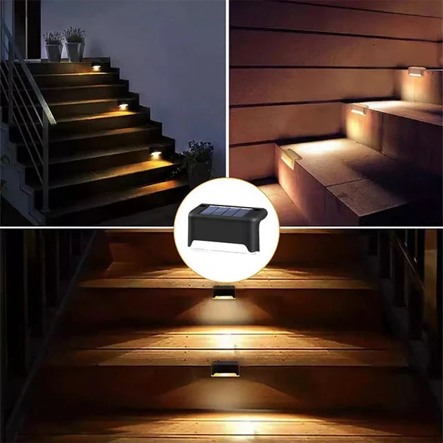 Black solar stair light illuminating outdoor steps and walls