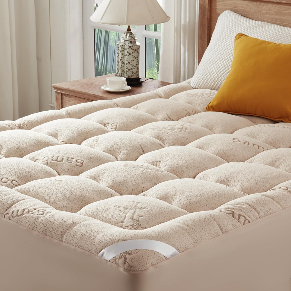 Quilted waterproof mattress cover with elasticated fitted edge