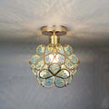 Floral ceiling light with a rounded decorative petal shade