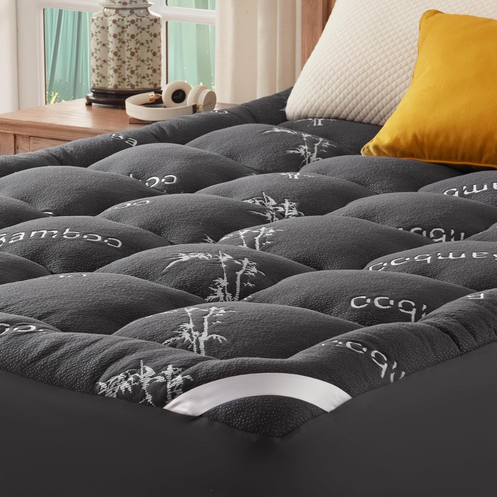 Quilted waterproof mattress cover with elasticated fitted edge