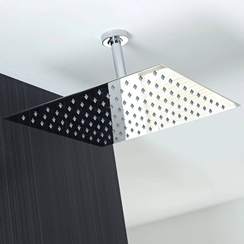 Ultra-thin silver rectangular rainfall shower head releasing an overhead water flow