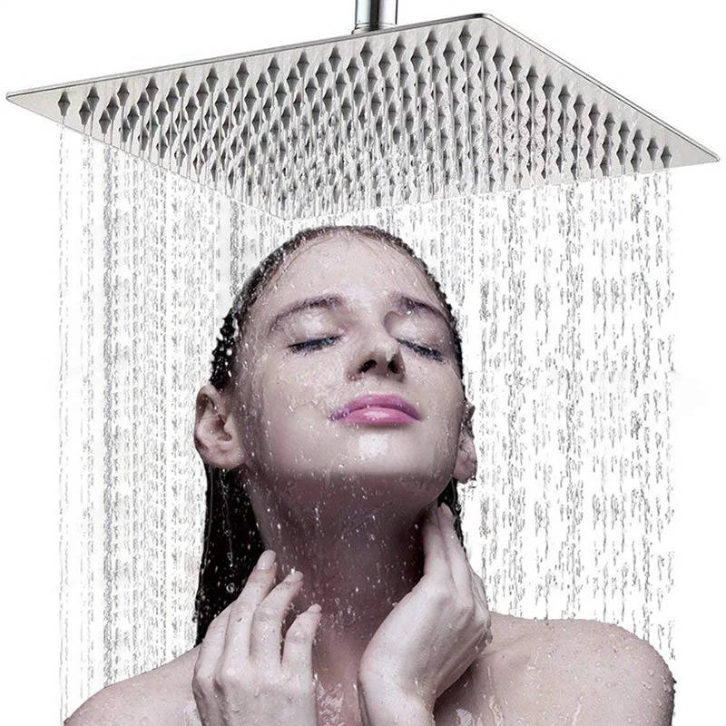 Ultra-thin silver rectangular rainfall shower head releasing an overhead water flow