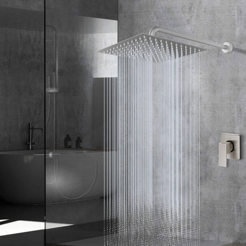 Ultra-thin silver rectangular rainfall shower head releasing an overhead water flow