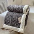 Textured sherpa blanket with a contrasting plush border