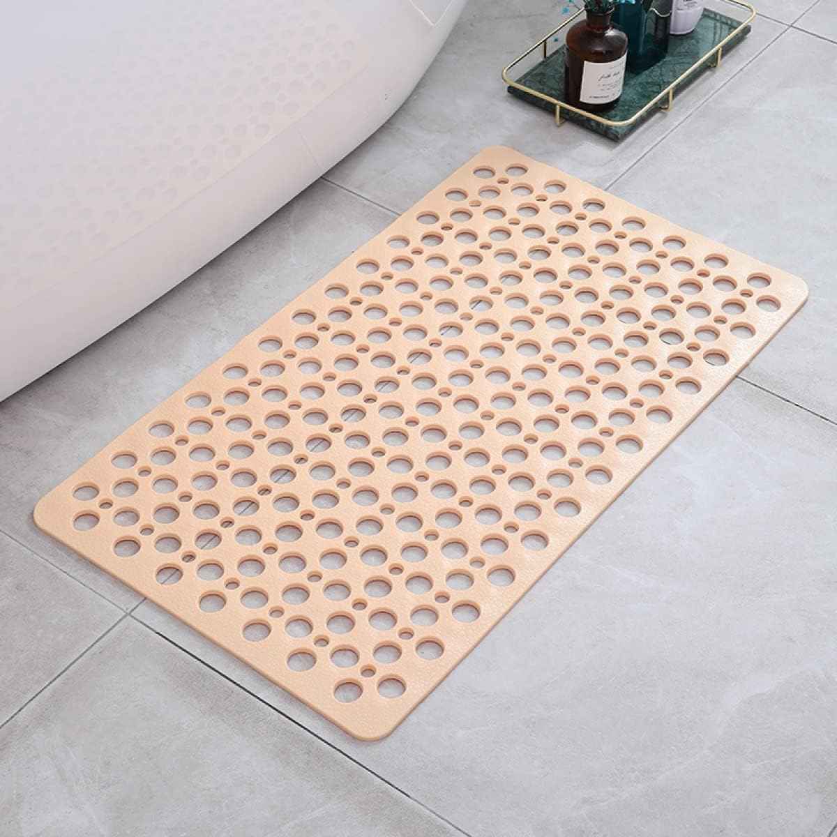 Perforated non-slip bath mat with repeated circular holes