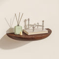 Half-round floating wall shelf with curved front edge and wood-effect finish