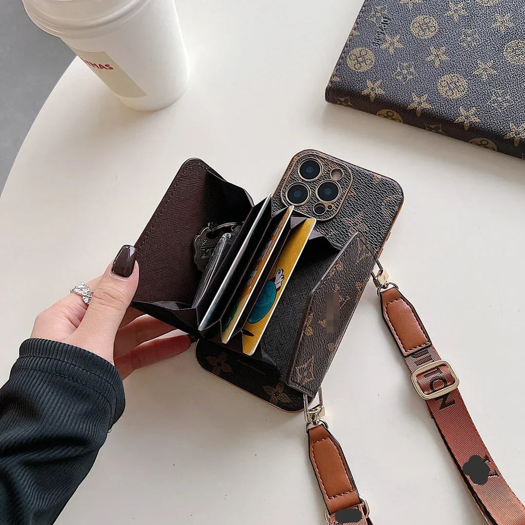 Brown patterned phone case with matching shoulder strap and gold-tone clips