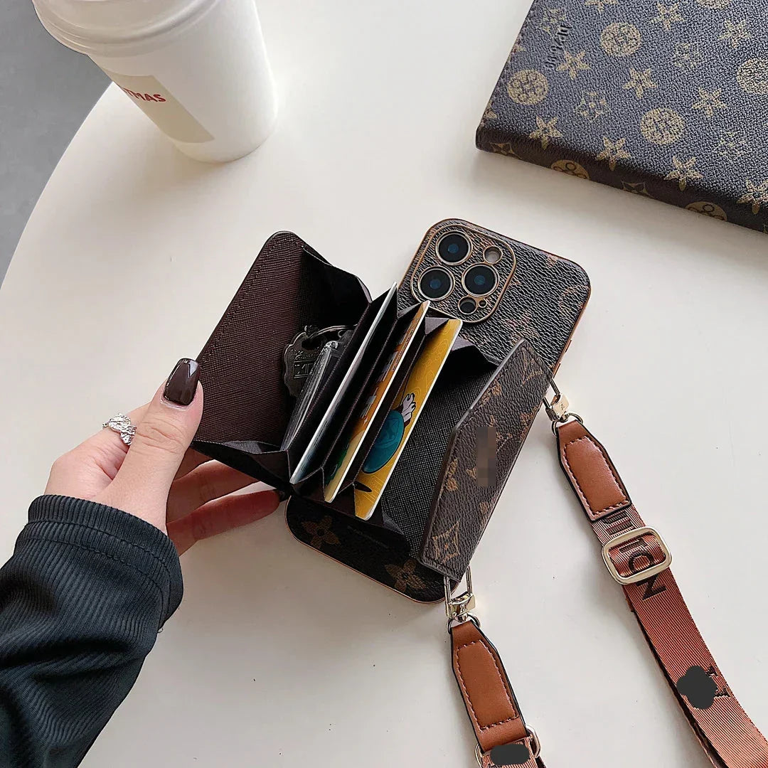 Brown patterned phone case with matching shoulder strap and gold-tone clips